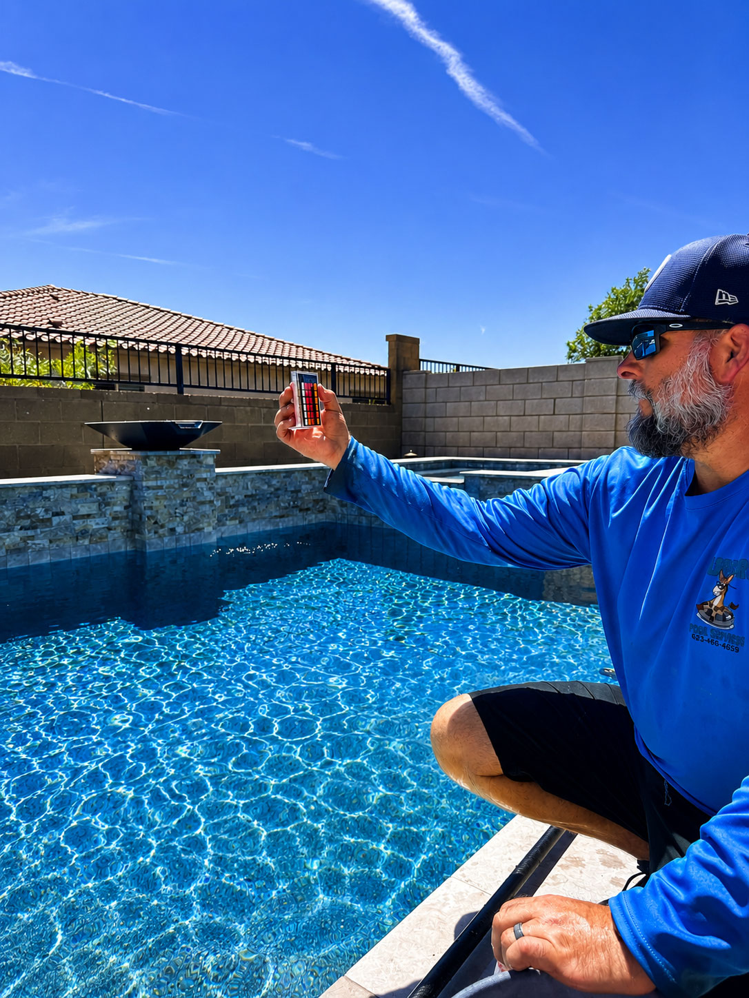 Burro Pools technician servicing a backyard pool